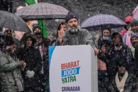 India&#39;s opposition Congress Party leader Rahul Gandhi speaks at a public rally as it snows in Srinagar, in Indian-administered Kashmir [Mukhtar Khan/AP Photo]