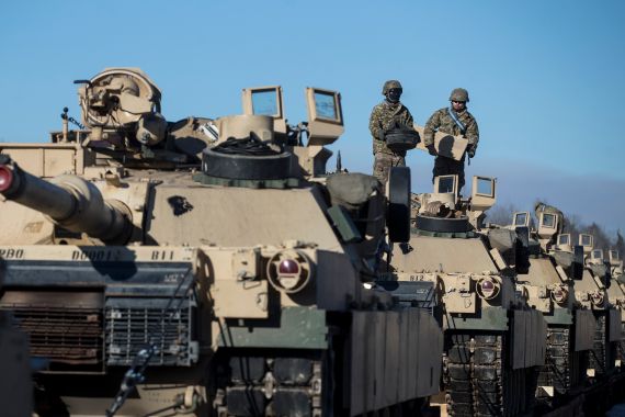 Members of the US Army's 4th Infantry prepare to unload some Abrams battle tanks after arriving at the Gaiziunai railway station, west of Vilnius, Lithuania in this file photo from 2017.