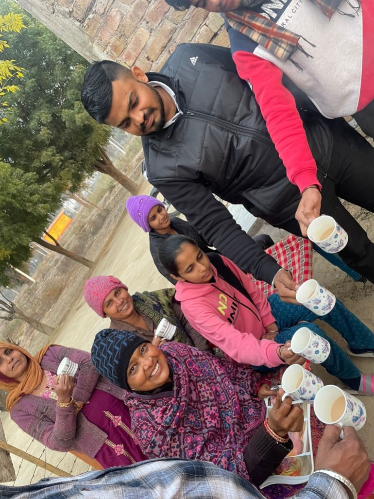 Prerna's family, dressed warmly for the cold weather, enjoy chai together