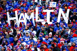 Buffalo football fans hold a sign spelling 'Hamlin' at a game.