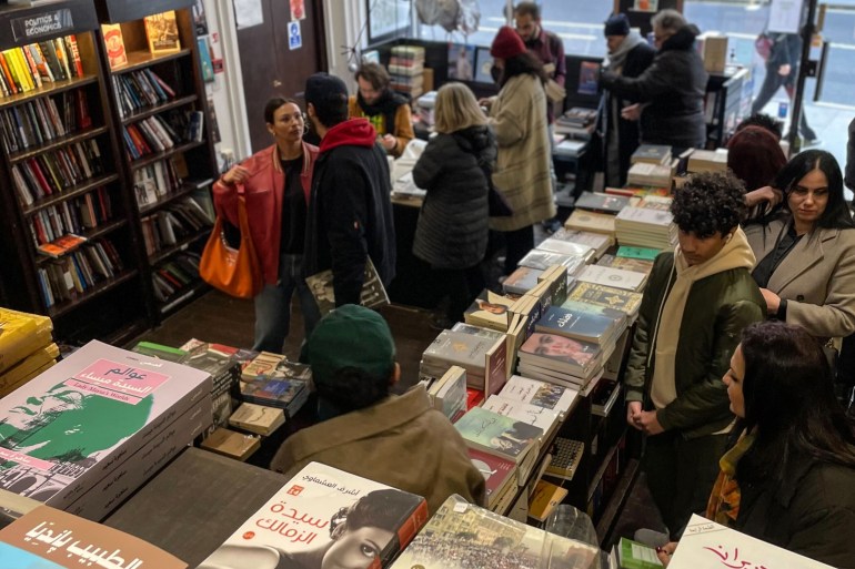 Customers inside Al Saqi Books during its closing-down sale