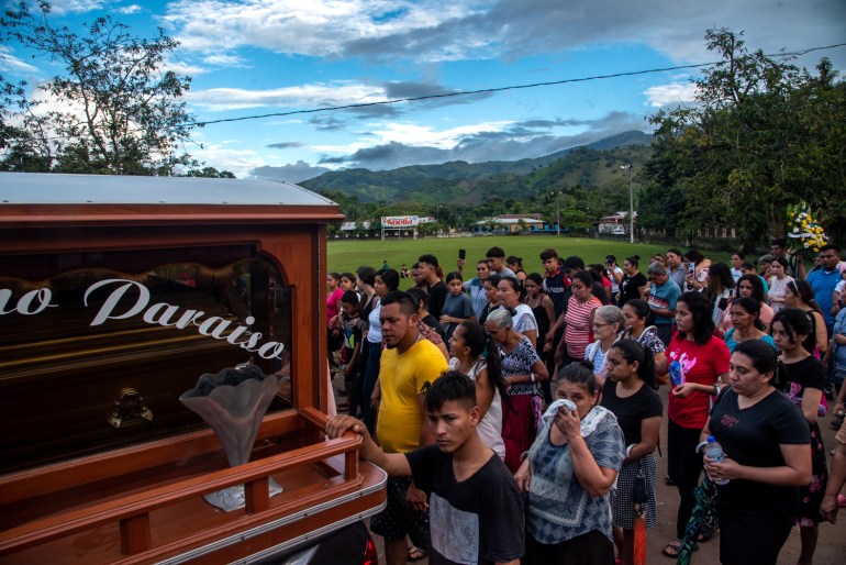 A funeral procession in the village of Gaupinol for slain environmentalists, Aly Dominguez and Jairo Bonilla [Seth Berry/Al Jazeera]