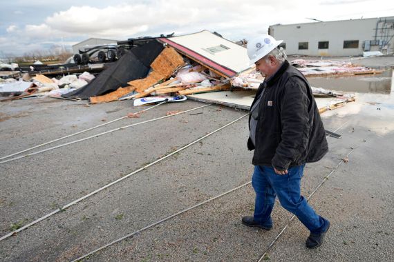A man surveys the damage from a tornado in Texas.