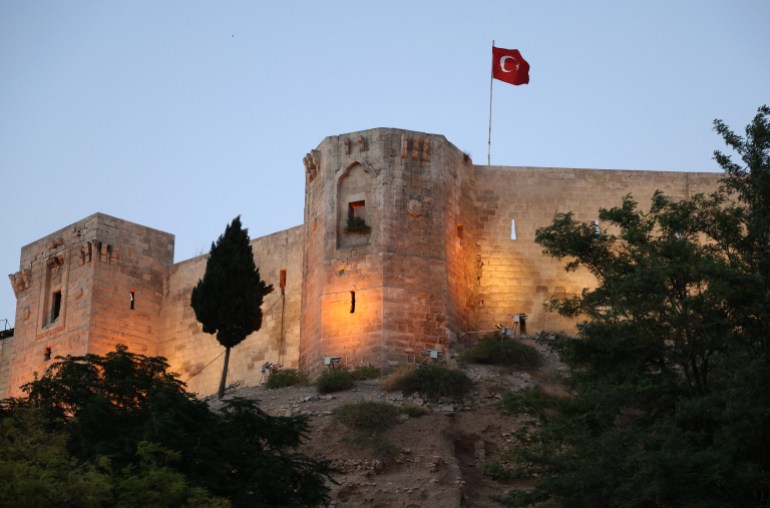 A picture shows the Gaziantep Castle at the historical district of the southeastern Turkish city of Gaziantep, where many Syrian refugees reside, on August 11, 2022. (Photo by OMAR HAJ KADOUR / AFP)