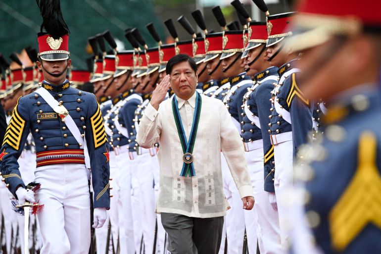 Philippine President Ferdinand Marcos Jr salutes during the 87th anniversary celebration of the Armed Forces of the Philippines in Quezon City, suburban Manila, in December 2022.