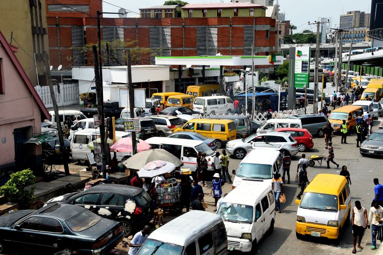 Drivers wait in line to buy fuel at and next to a filling station, causing traffic gridlock at Obalende in Lagos on January 30, 2023 [Pius Utomi Ekpei/AFP]