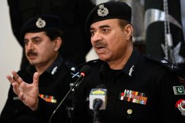 Moazzam Jah Ansari (R), head of the Khyber-Pakhtunkhwa province police force, speaks during a press conference at Peshawar&#39;s police headquarters [Abdul Majeed/AFP]