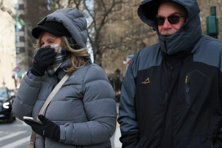People bundle up in New York City as temperatures dip.