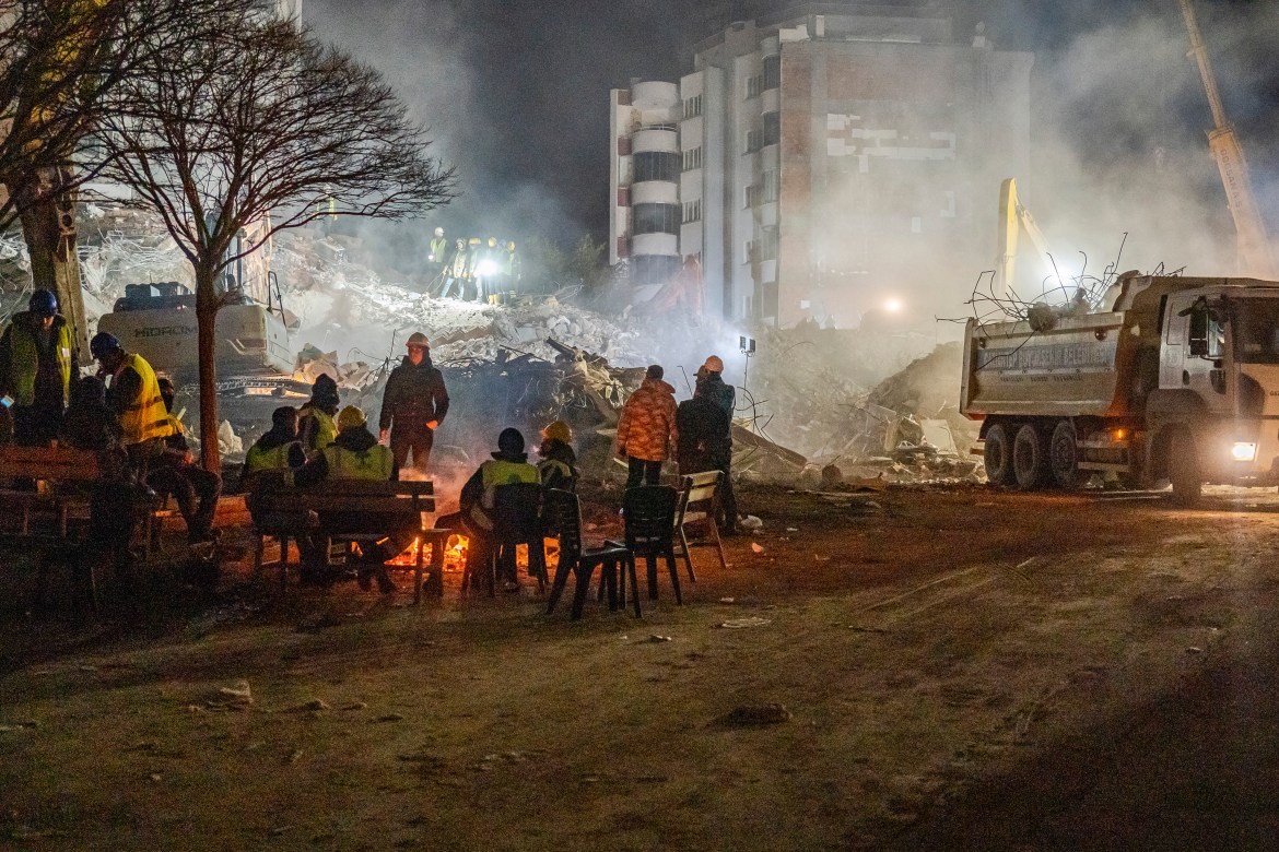 A group of rescue workers in the Ibrahimli neighbourhood in Gaziantep —  the area with the highest number of collapsed buildings in the city — continues excavations at night with the hope of still finding survivors