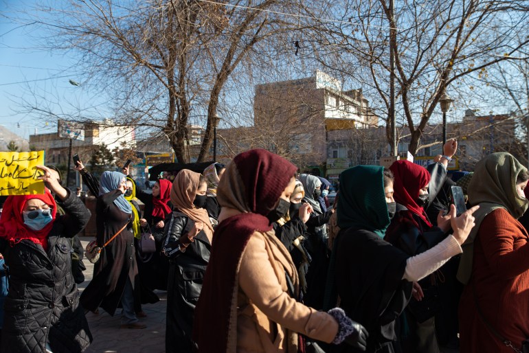 Afghan women protest against new Taliban ban on women accessing University Education on December 22, 2022 in Kabul, Afghanistan. A group of Afghan women rallied in Kabul against a governmental order banning women from universities. Armed guards barred women from accessing university sites since the suspension was announced on December 20. (Photo by Stringer/Getty Images)
