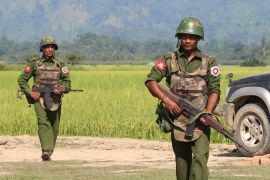 (FILES) This file photo taken on October 21, 2016 shows armed Myanmar army soldiers patrolling a village in Maungdaw located in Rakhine State as security operation continue following the October 9, 2016 attacks by armed militant Muslim. - Myanmar's military announced December 21 it would suspend "all military movements" in the country's troubled northern and eastern regions for almost five months, an unprecedented step observers say could coax ethnic rebel organisations into the country's fractious peace process. (Photo by STR / AFP)