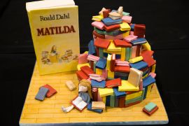 A cake decorated in the style of the Roald Dahl children's book "Matilda" is displayed at the Cake and Bake show in London, Britain October 3, 2015. REUTERS/Neil Hall