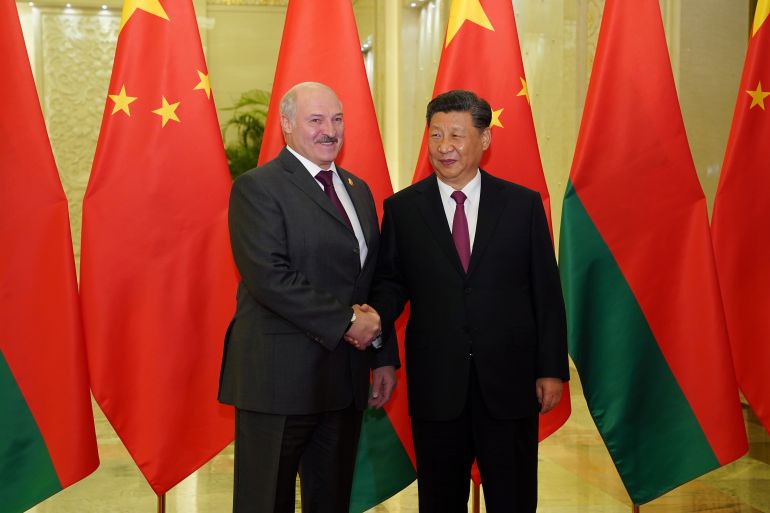 Chinese President Xi Jinping shakes hands with Belarusian President Alexander Lukashenko