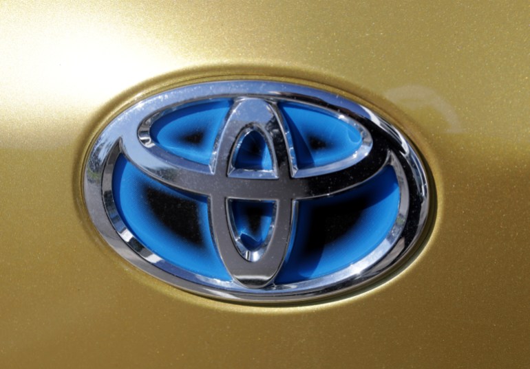Close-up of a Toyota logo on a car.