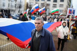 People hold a Russian flag during a demonstration in support of Russia under the slogan "We are not neutral! We are with Russia! Victory is ours!", in Sofia, Bulgaria, December 10, 2022, as Russia's invasion of Ukraine continues. REUTERS/Spasiyana Sergieva