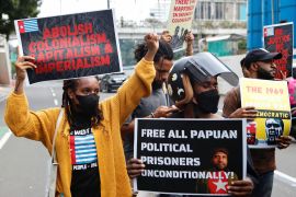 Demonstrators outside the United Nations building in Jakarta, Indonesia, carry placards to mark the Indonesian military operation Trikora - which seized West Papua from Dutch colonial control in the 1960s [File: Ajeng Dinar Ulfiana/Reuters]