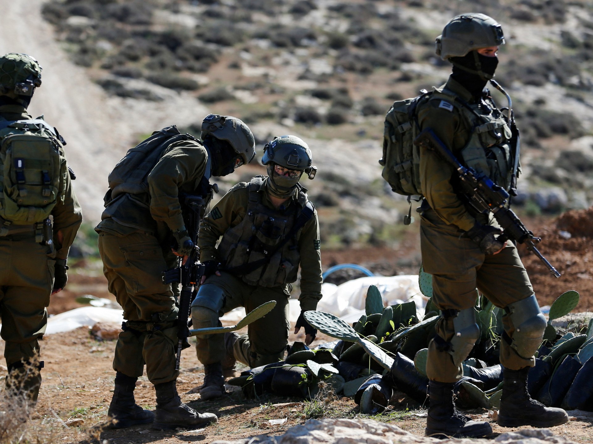 Israeli army kills Palestinian, settlers march to illegal outpost
