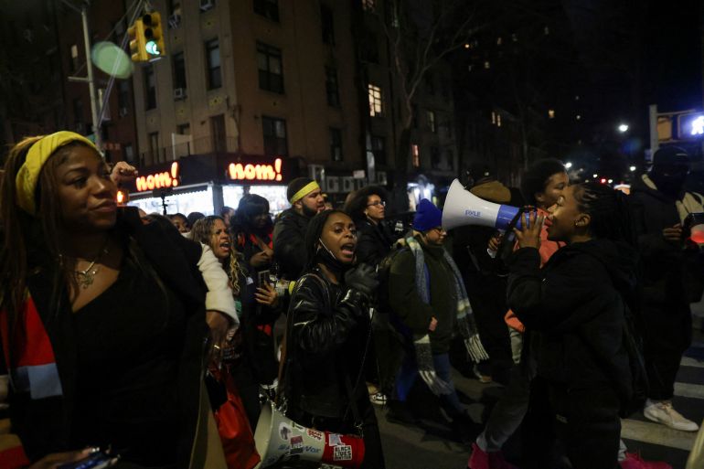 People take part in a protest following the release of a video showing police officers beating Tyre Nichols, the young Black man who died three days after he was pulled over while driving during a traffic stop by Memphis police officers, in New York, U.S., January 28, 2023. REUTERS/Jeenah Moon
