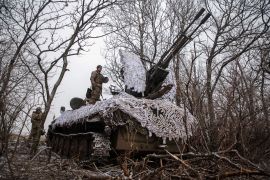 Ukrainian soldiers operate a tank with anti-aircraft cannon near a front line in the Donetsk region of Ukraine on Wednesday, February 1 [Oleksandr Ratushniak/Reuters]