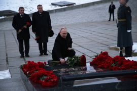 Russian President Vladimir Putin lays flowers on the tomb of Soviet Marshal Vasily Chuikov at the Mamayev Kurgan memorial complex [Konstantin Zavrazhin/Sputnik/Pool via Reuters]