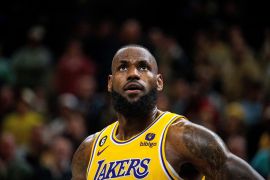 Lebron James in his Lakers jersey looking up.