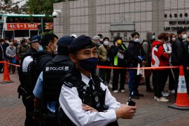 There was heavy police presence outside the West Kowloon Magistrates&#39; Courts building ahead of the opening of the trial of the 47 pro-democracy activists [Tyrone Siu/Reuters]