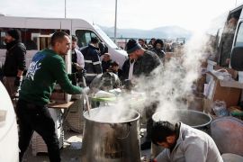 Volunteers prepare shorba for the internally displaced people at the Yeni Hatay Stadyumu camp, Turkey.