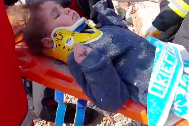 A?child?is rescued from the rubble after 150 hours in the aftermath of an earthquake in Hatay, Turkey, February 12, 2023 in this screen grab taken from a handout video. Turkish Health Ministry/ Handout via REUTERS. THIS IMAGE HAS BEEN SUPPLIED BY A THIRD PARTY.
