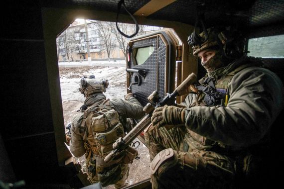Ukrainian service members exit an armoured personnel carrier, amid Russia's attack on Ukraine, in the front-line town of Bakhmut, Ukraine.