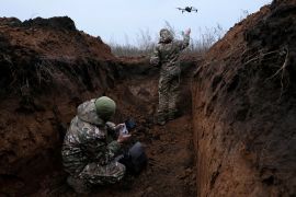 Two soldiers with the 58th Independent Motorized Infantry Brigade of the Ukrainian Ground Forces who wanted to be identified as &#39;Ghost&#39;, 24, and &#39;Soap&#39;, 30, release a drone for a test flight [File: Leah Millis/Reuters]