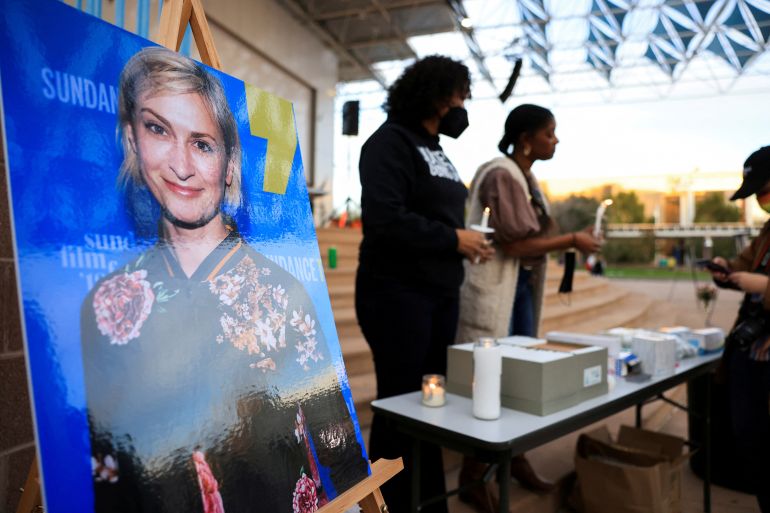 An image of cinematographer Halyna Hutchins on an easel at a memorial