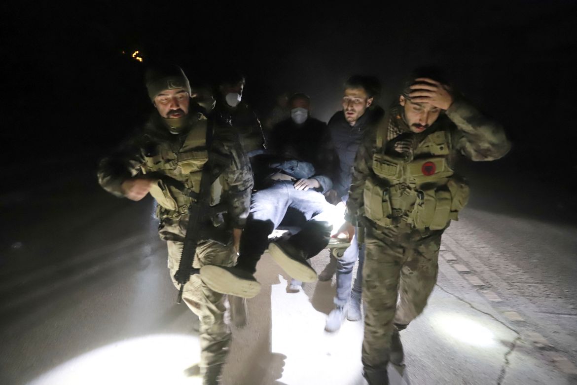 Members of Turkish police special forces carry a wounded man