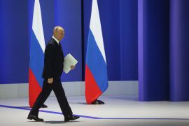 Russian President Vladimir Putin walks to deliver his annual address to the Federal Assembly in Moscow, Russia February 21, 2023. Sputnik/Sergei Karpukhin/Pool via REUTERS ATTENTION EDITORS - THIS IMAGE WAS PROVIDED BY A THIRD PARTY.