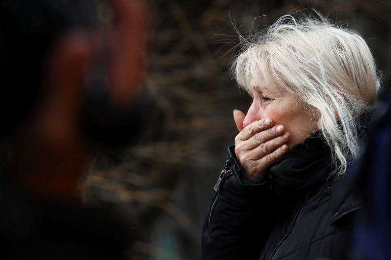 A woman reacts after a shelling near a bus station, amid Russia's attack on Ukraine, in Kherson, Ukraine February 21, 2023. REUTERS/Lisi Niesner TPX IMAGES OF THE DAY