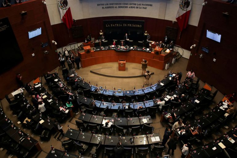 FILE PHOTO: A view shows senators during a session at Mexico's senate as they discusses an initiative by President Andres Manuel Lopez Obrador to give the Army control over the civilian-led National Guard, at Mexico's Senate building, in Mexico City, Mexico September 8, 2022. REUTERS/Henry Romero/File Photo
