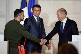 Ukraine's President Volodymyr Zelenskyy (L) , Germany's Chancellor Olaf Scholz and French President Emmanuel Macron in Paris.