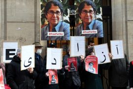 (FILES) In this file photo taken on January 13, 2022, colleagues of the French-Iranian academic Fariba Adelkhah, hold placards depicting her as they gather in front of the high education school Science-Po in Paris, in order to support her following the decision of the Iranian government to send her back to prison after a period of house arrest. - Iranian authorities on February 10, 2023, released Adelkhah from prison, who was first arrested in June 2019 and was serving a five-year sentence on national security charges vehemently denied by supporters, a source close to her said. (Photo by Thomas COEX / AFP)