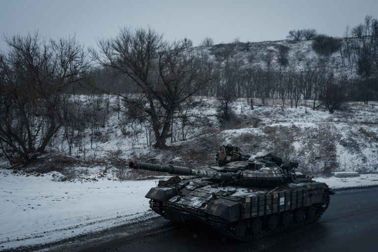 A Ukrainian main battle tank runs on the road near Kupiansk