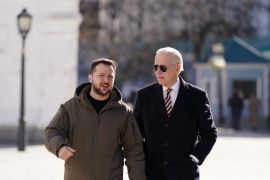 US President Joe Biden, right, walks beside Ukrainian President Volodymyr Zelenskyy in Kyiv. [Dimitar Dilkoff/AFP]