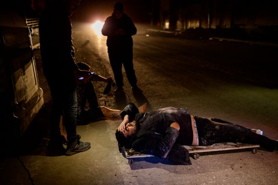 Two injured people lie on the ground after a 6.4-magnitude quake hit the Hatay province in Antakya, southern Turkey.