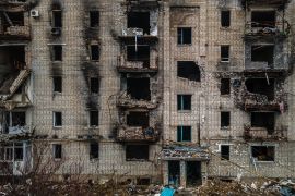 An aerial view shows residential buildings damaged by shelling in Izyum, Kharkiv region on February 20, 2023