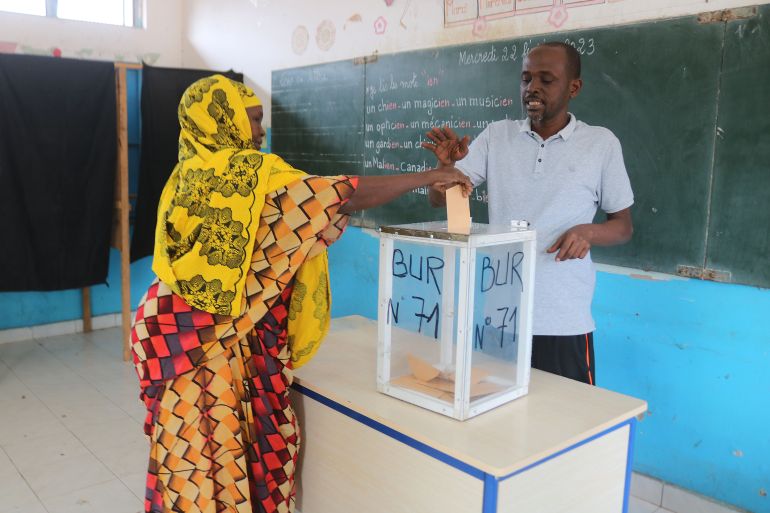 A voter casts her ballot during a parliamentary elections in Djibouti city on February 24, 2023