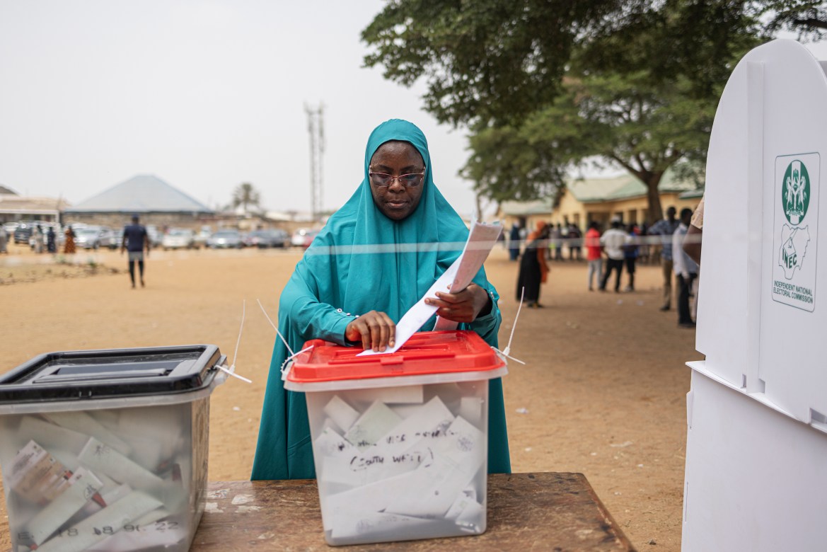 A voter casts her ballot