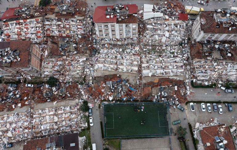 An aerial view of debris of a series of collapsed buildings in Hatay, Turkey.