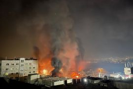 Smoke and flames rise after Israeli settlers went on a rampage in the West Bank town of Huwara on February 27, 2023 [Hisham K K Abu Shaqra/Anadolu Agency]