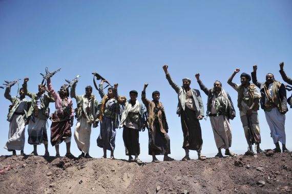 Hawthi Shiite rebels chant slogans at the compound of the army's First Armored Division, after they took it over, in Sanaa, Yemen
