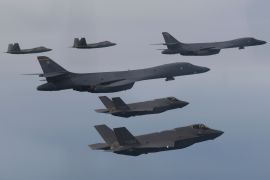 US Air Force B-1B bombers (centre), F-22 fighter jets and South Korean Air Force F-35 fighter jets (bottom) fly over South Korea during a joint air drill last month [South Korean Defense Ministry via AP Photo]