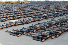 Assault rifles and missiles seized by the French navy lay on the deck of a ship at an undisclosed location [US military&#39;s Central Command via AP]