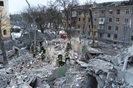 Rescuers work at the scene of an apartment building hit by a Russian rocket in Kramatorsk, Ukraine [Yevgen Honcharenko/AP Photo]