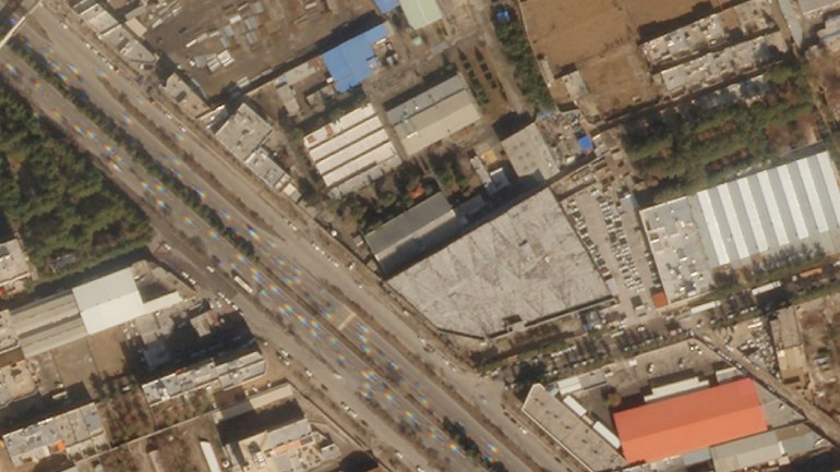 This Planet Labs PBC satellite image shows damage to the roof of an Iranian military workshop, center, after a drone strike in Isfahan, Iran, Thursday, Feb. 2, 2023. Satellite photos analyzed by The Associated Press on Friday show damage to what Iran described as a military workshop attacked by Israeli drones, the latest such attack amid a shadow war between the two countries.  (Planet Labs PBC via AP)
